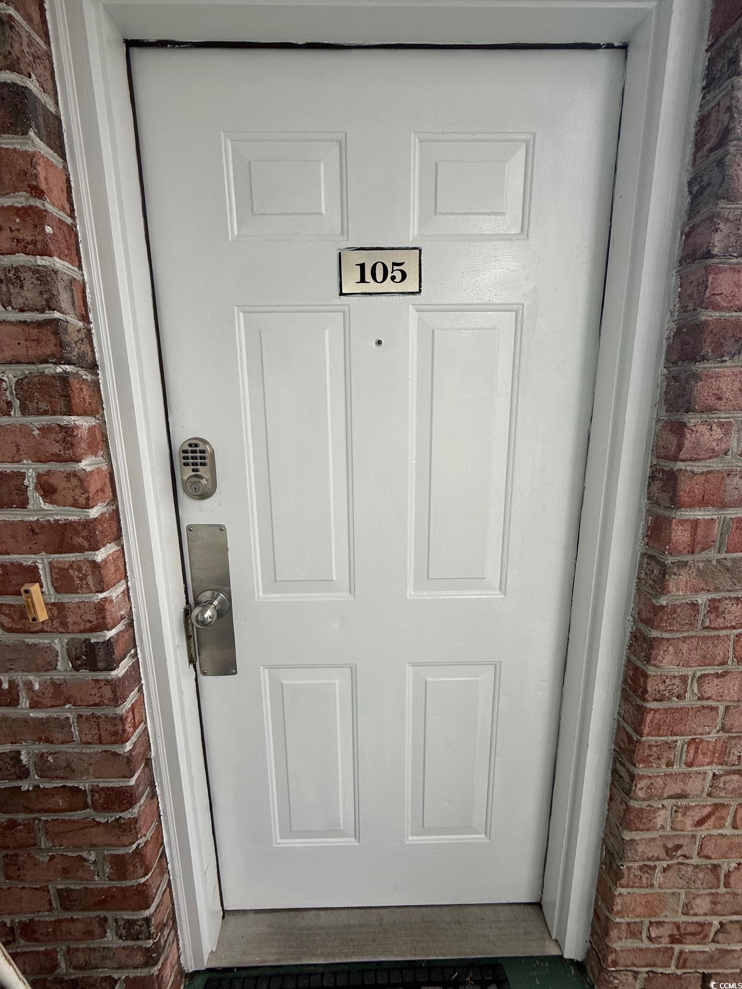 4860 Carnation Circle, Unit 17105 Myrtle Beach, SC 29577 - Photo 28 of 29 View of exterior entry with brick siding