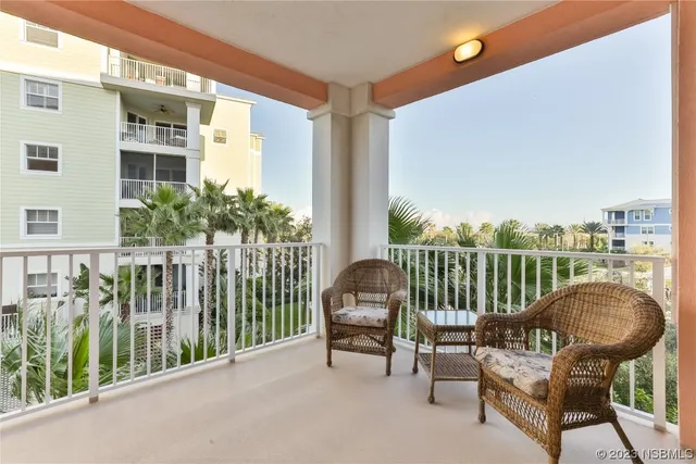 a view of a balcony with furniture