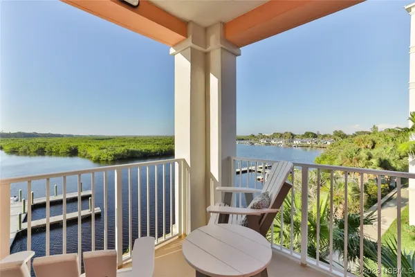 a view of a balcony with furniture