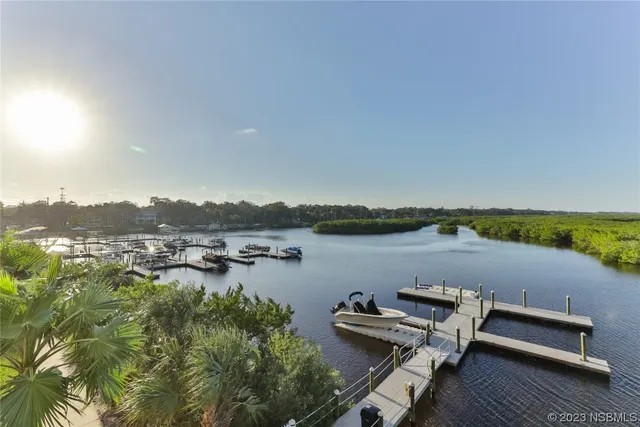 a bathroom with a granite countertop sink a mirror and a shower