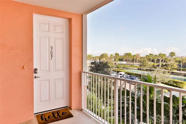a view of balcony with furniture