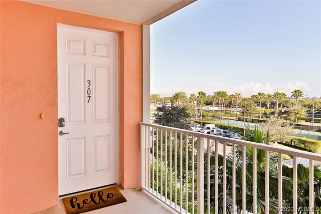 a view of balcony with furniture