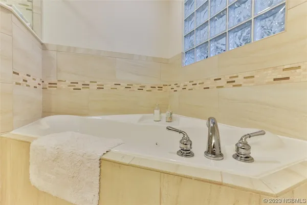 a bedroom with bed and a table