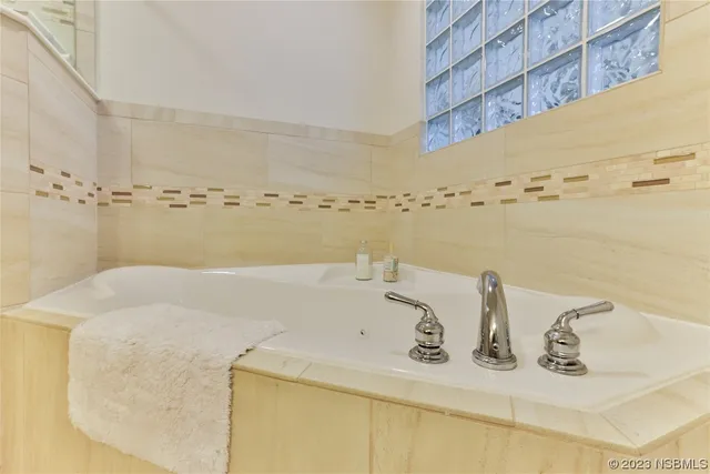 a bedroom with bed and a table