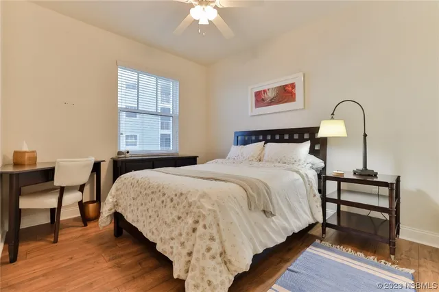 a bedroom with a bed and a table