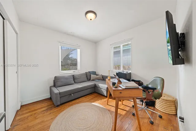 a living room with furniture and a window