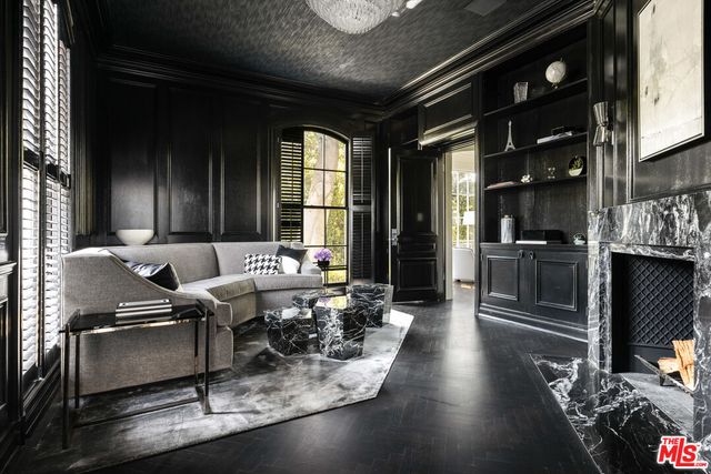 a living room with lots of furniture and gym equipment