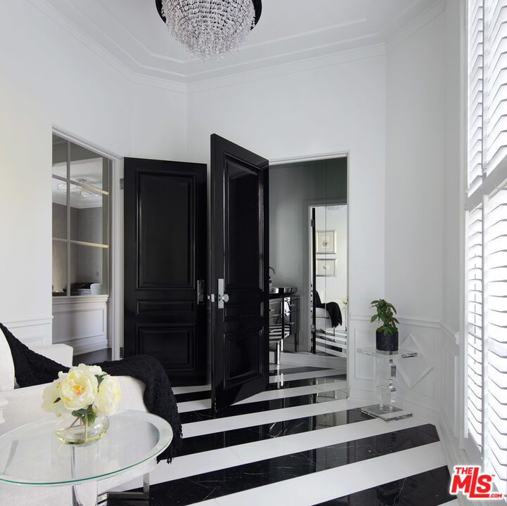 301 Copa De Oro Road Los Angeles, CA 90077 - Photo 23 of 33 a living room with furniture and wooden floor