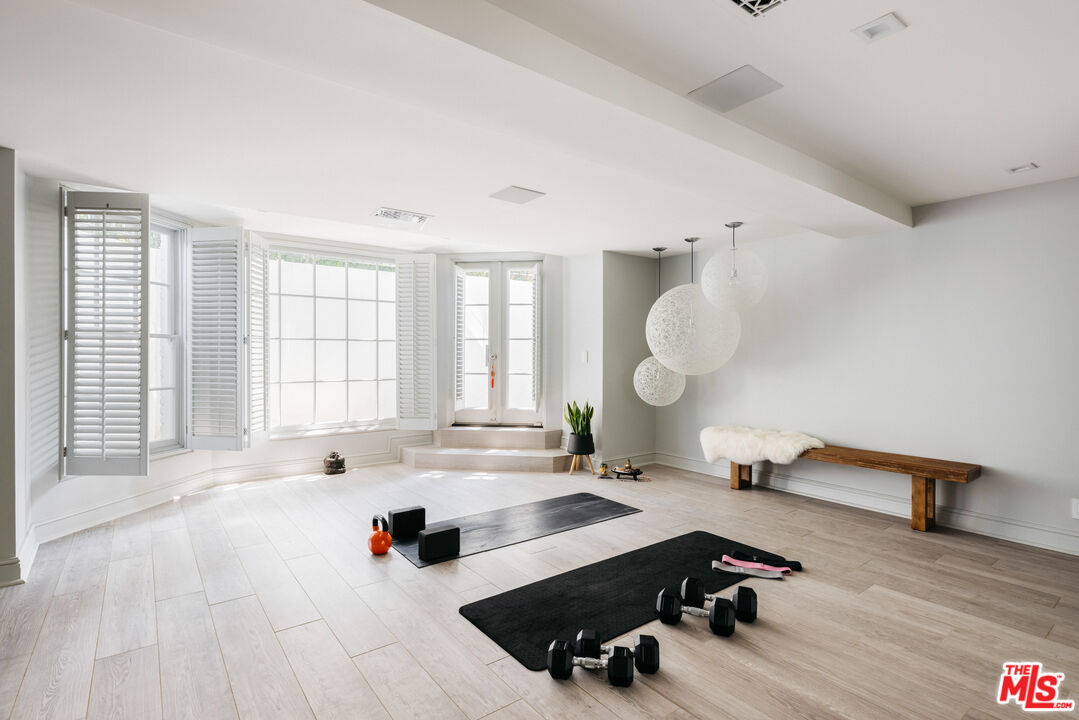 301 Copa De Oro Road Los Angeles, CA 90077 - Photo 25 of 33 a very nice looking room with a large window and a couch