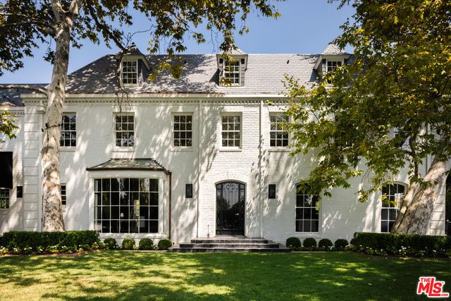 front view of a building with a swimming pool