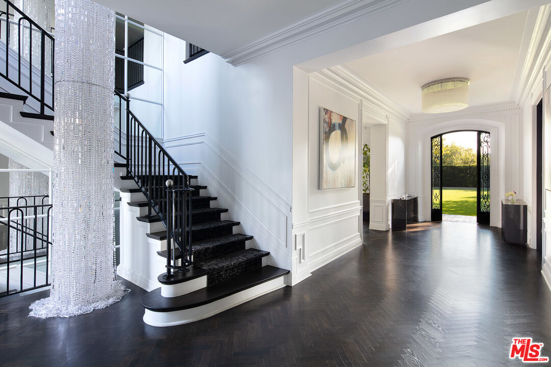 301 Copa De Oro Road Los Angeles, CA 90077 - Photo 7 of 33 a view of an entryway with wooden floor and stairs