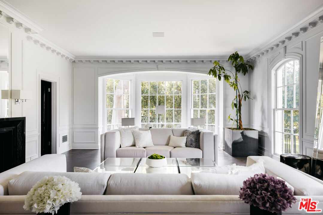 301 Copa De Oro Road Los Angeles, CA 90077 - Photo 8 of 33 a living room with furniture and a large window