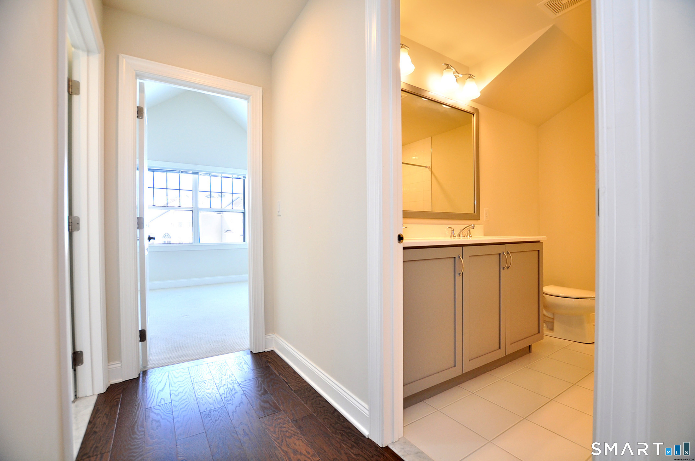 149 Ridgewood Drive Middlebury, CT 06762 - Photo 19 of 30 a view of a kitchen with wooden floor and a window
