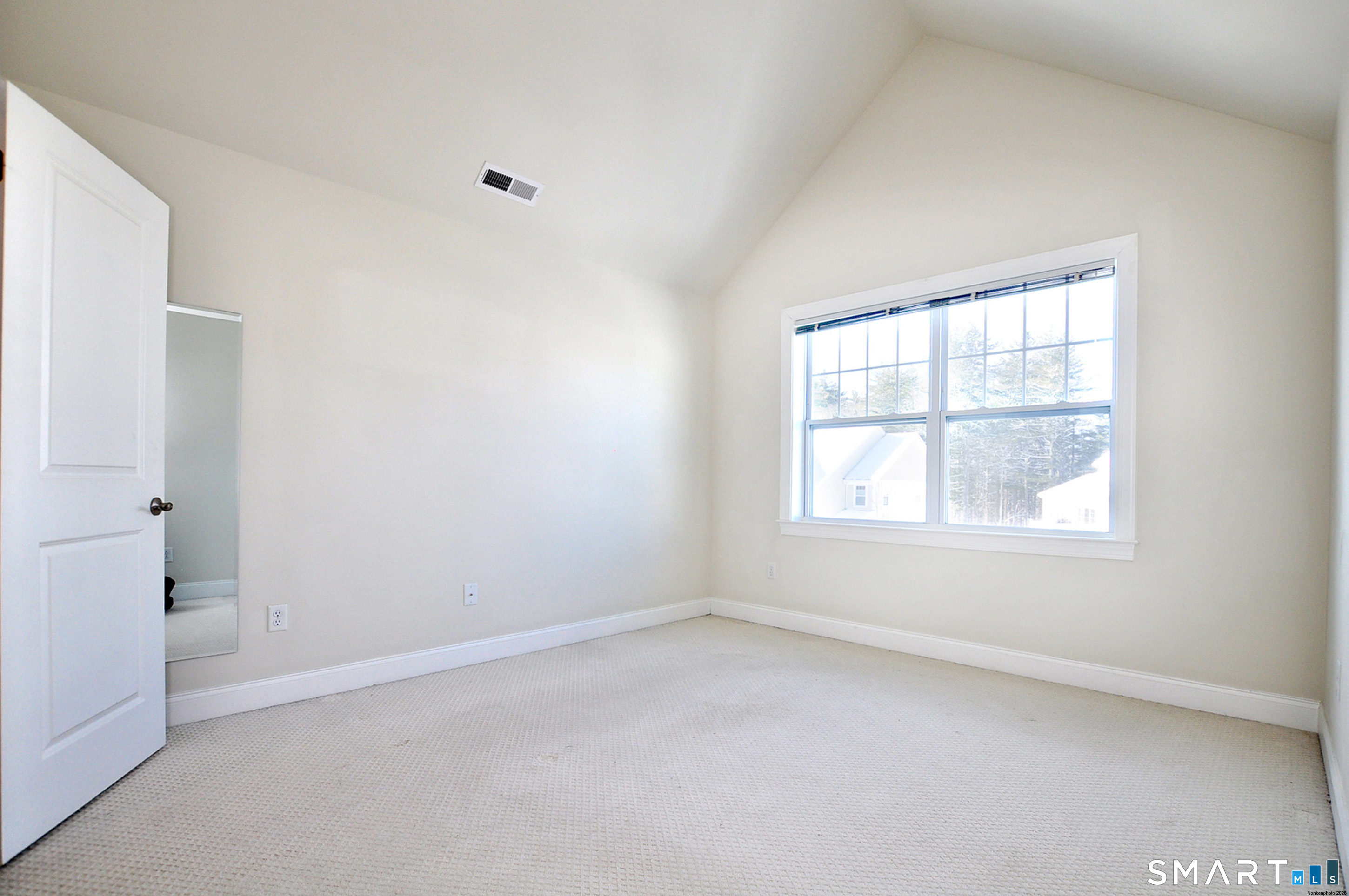 149 Ridgewood Drive Middlebury, CT 06762 - Photo 21 of 30 an empty room with a window