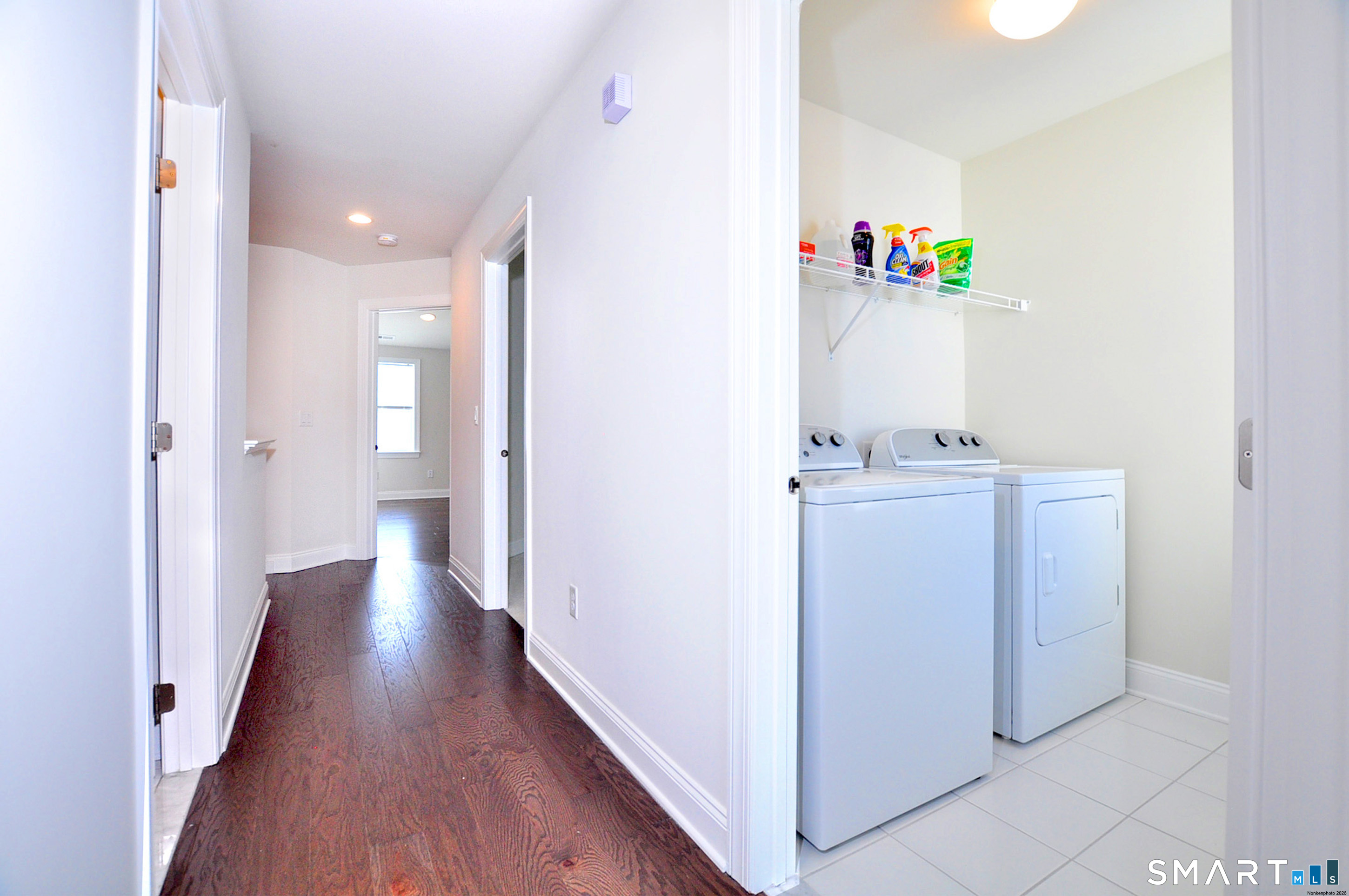 149 Ridgewood Drive Middlebury, CT 06762 - Photo 25 of 30 a view of a hallway with wooden floor
