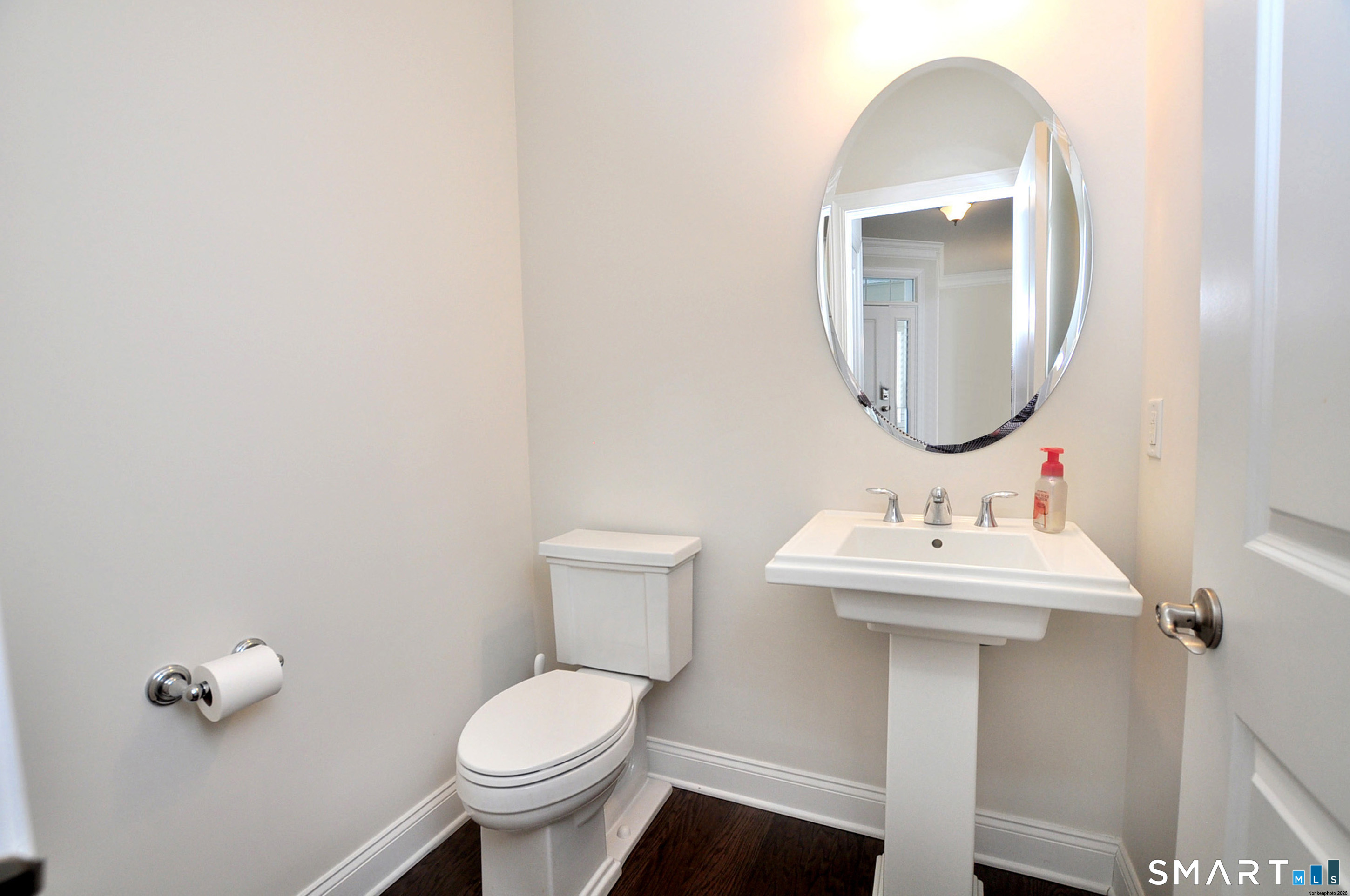 149 Ridgewood Drive Middlebury, CT 06762 - Photo 7 of 30 a bathroom with a toilet a sink and mirror