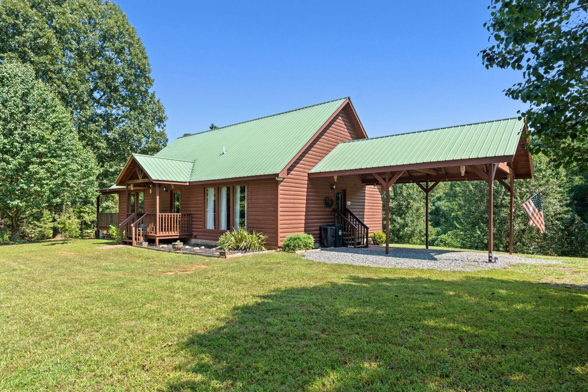 947 Belltown Road Copperhill, TN 37317 - Photo 24 of 26 a house view with a sitting space and garden view