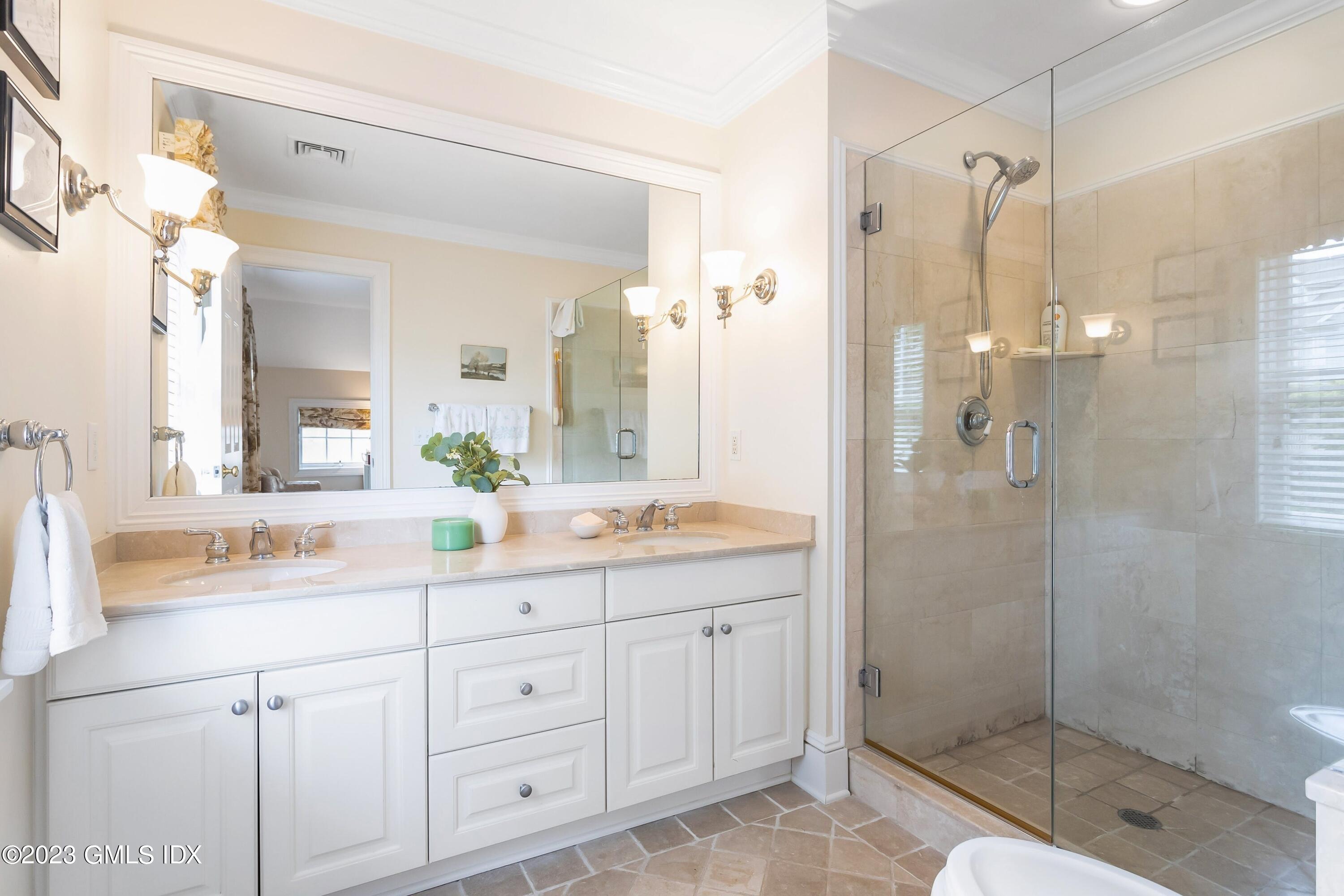 124 East Elm Street, Unit WEST Greenwich, CT 06830 - Photo 13 of 23 a bathroom with a shower sink and mirror