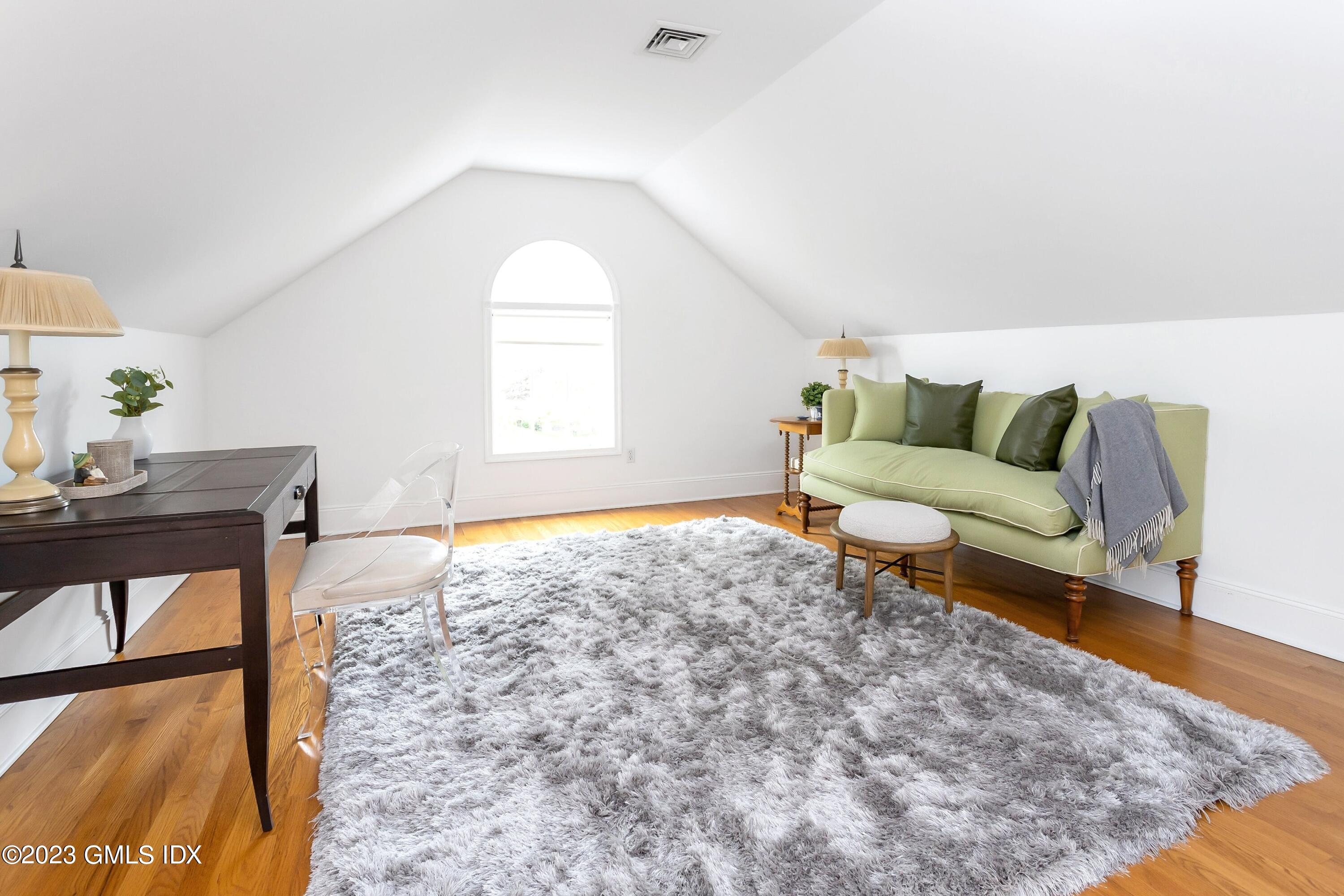 124 East Elm Street, Unit WEST Greenwich, CT 06830 - Photo 16 of 23 a living room with furniture and a window