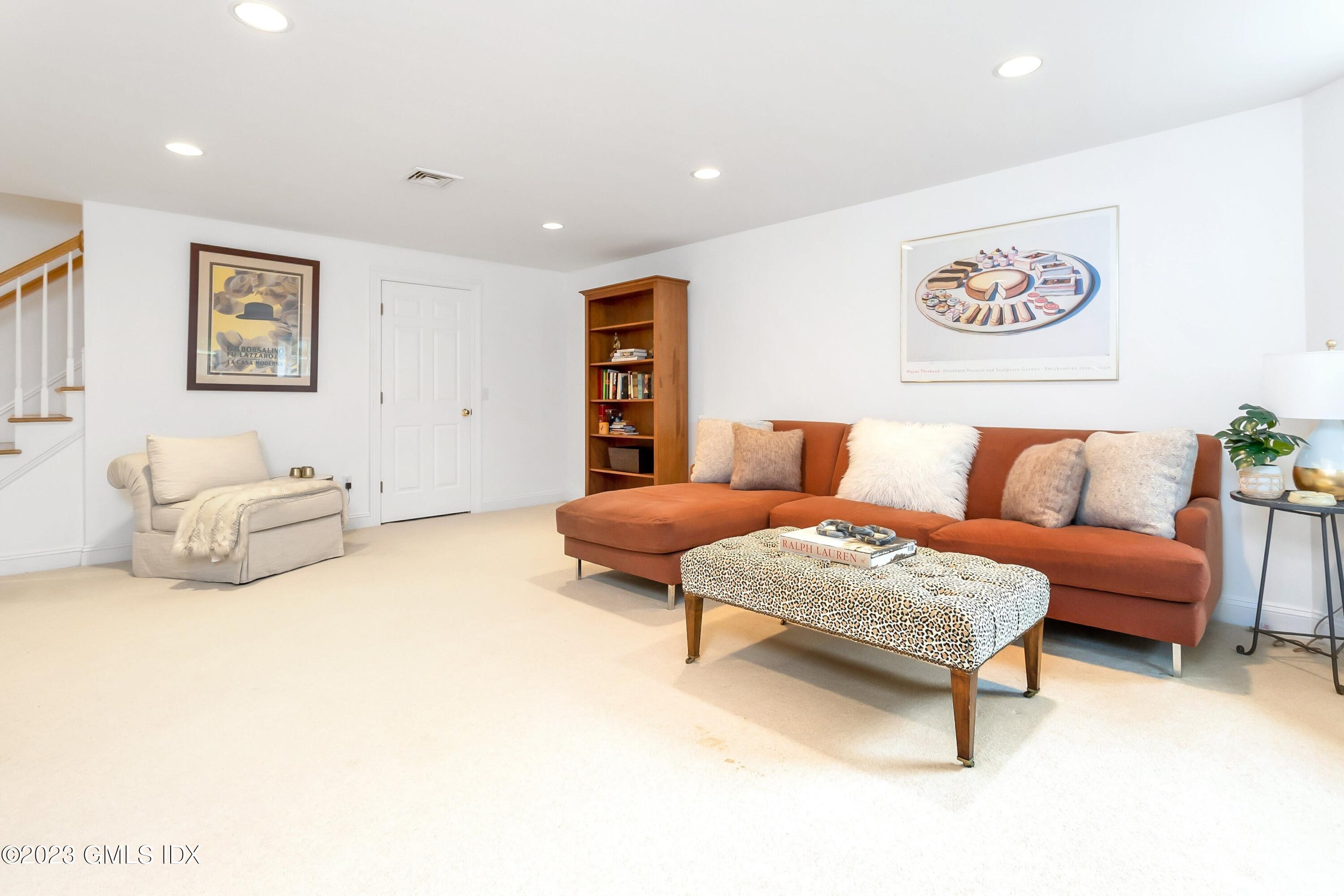 124 East Elm Street, Unit WEST Greenwich, CT 06830 - Photo 18 of 23 a bedroom with furniture and a couch