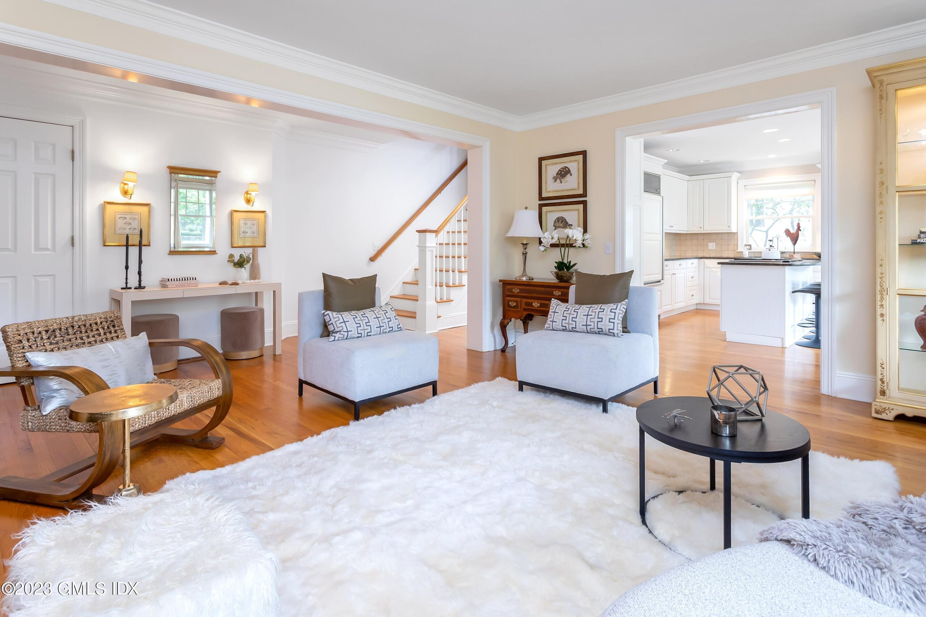 124 East Elm Street, Unit WEST Greenwich, CT 06830 - Photo 9 of 23 a living room with furniture and a wooden floor