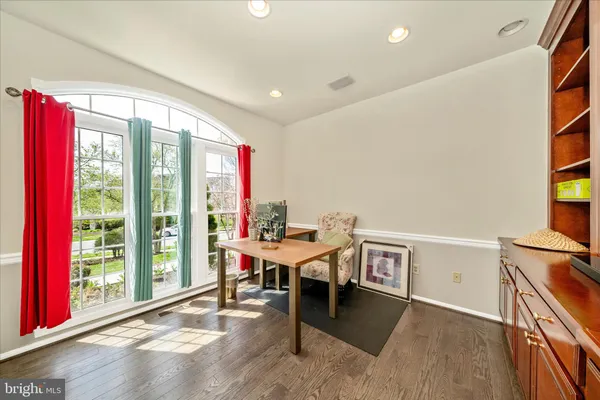 a large kitchen with stainless steel appliances and a refrigerator