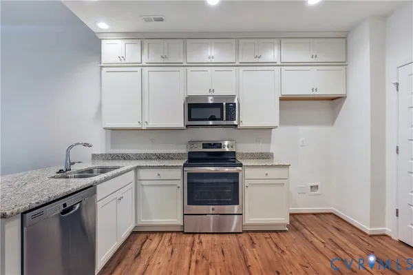 a kitchen with a stove and a sink