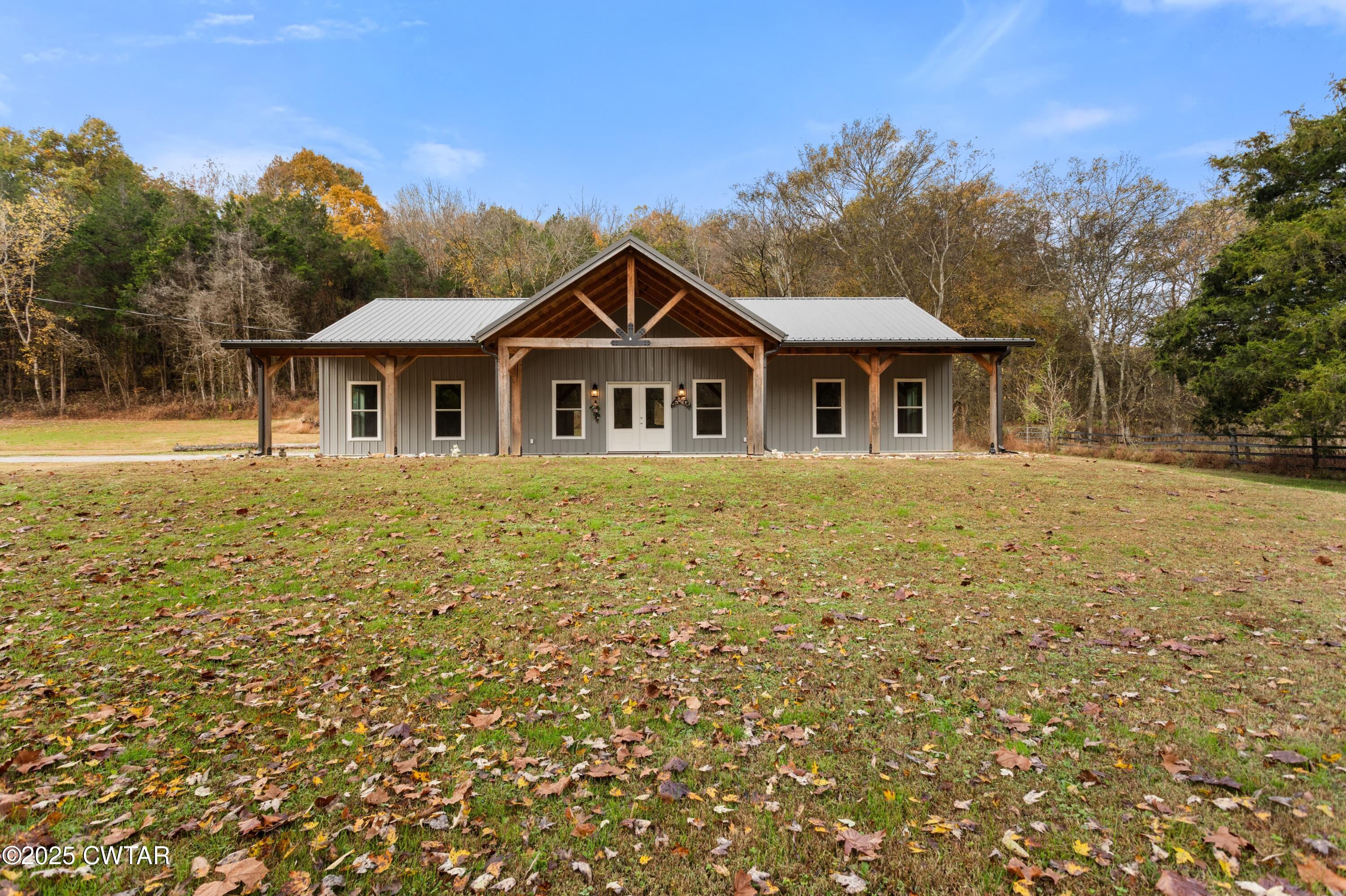 3154 Dodson Gap Road Culleoka, TN 38451 - Photo 1 of 36 a front view of a house with a garden