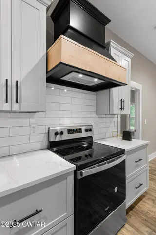 a kitchen with a stove and a microwave