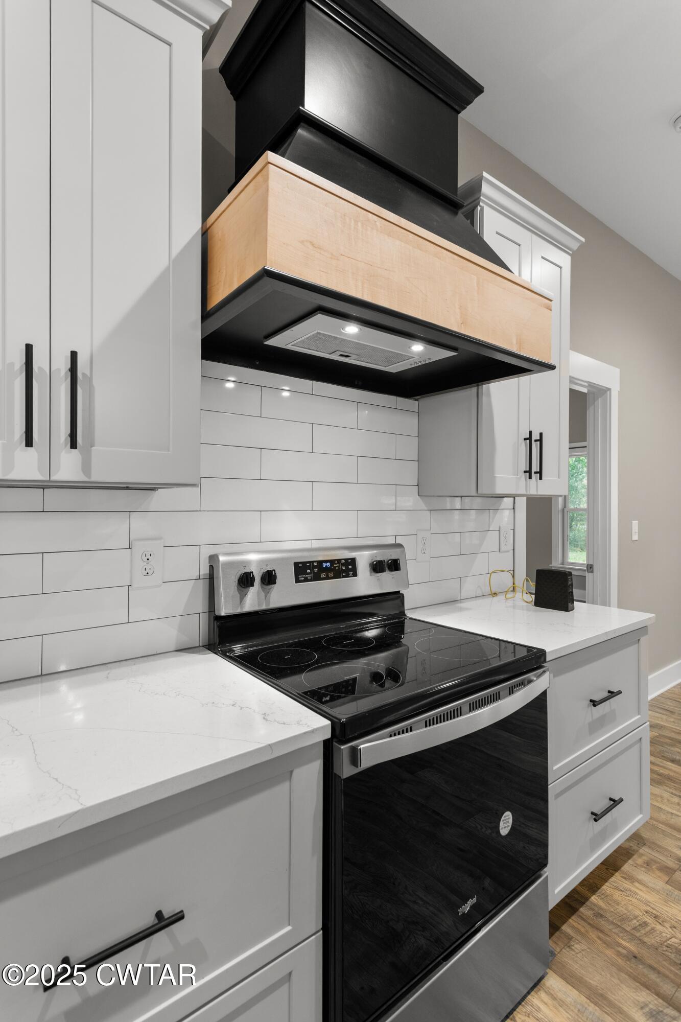 3154 Dodson Gap Road Culleoka, TN 38451 - Photo 12 of 36 a kitchen with a stove and a microwave