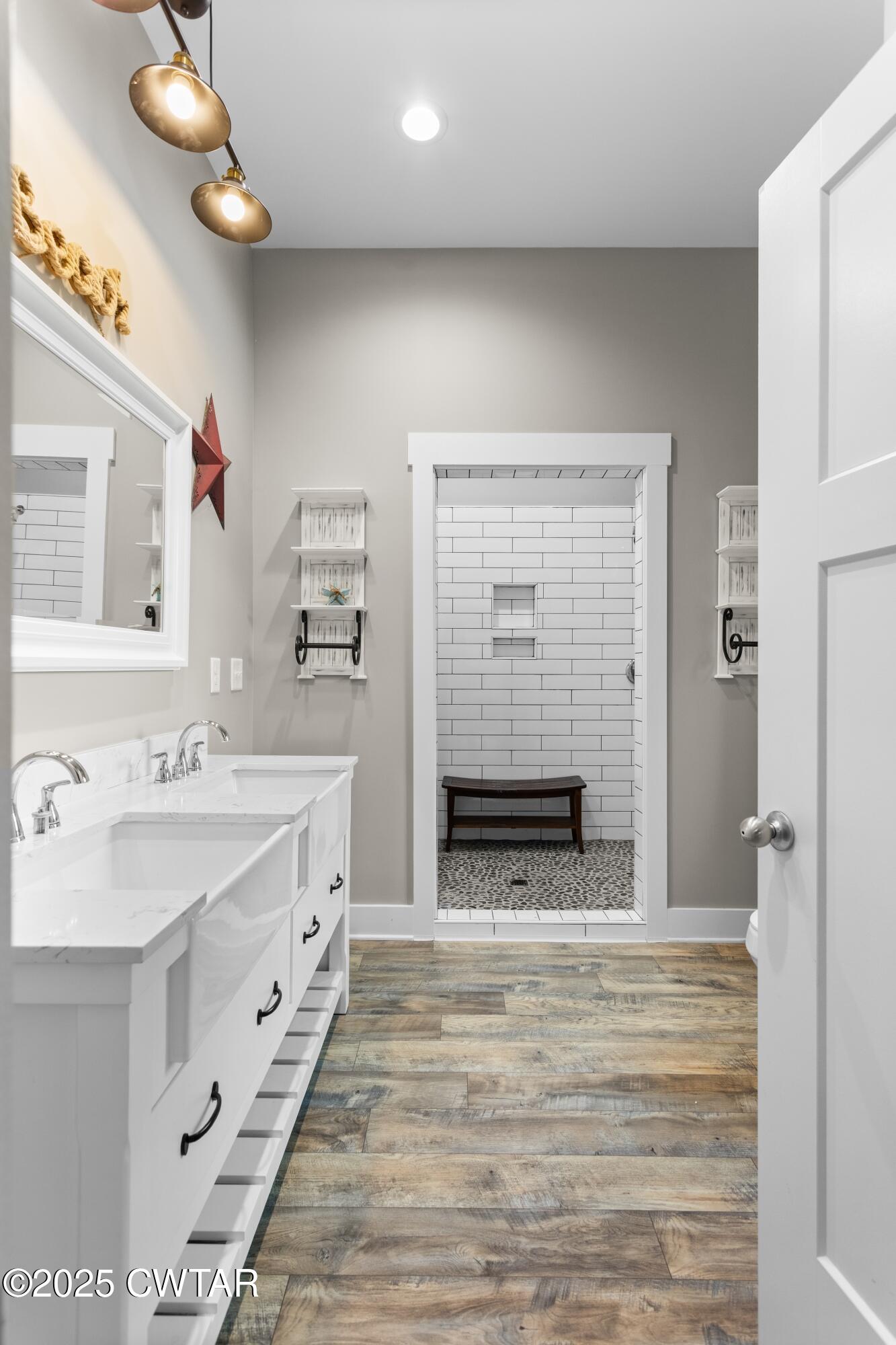 3154 Dodson Gap Road Culleoka, TN 38451 - Photo 18 of 36 a spacious bathroom with a sink a mirror and a shower