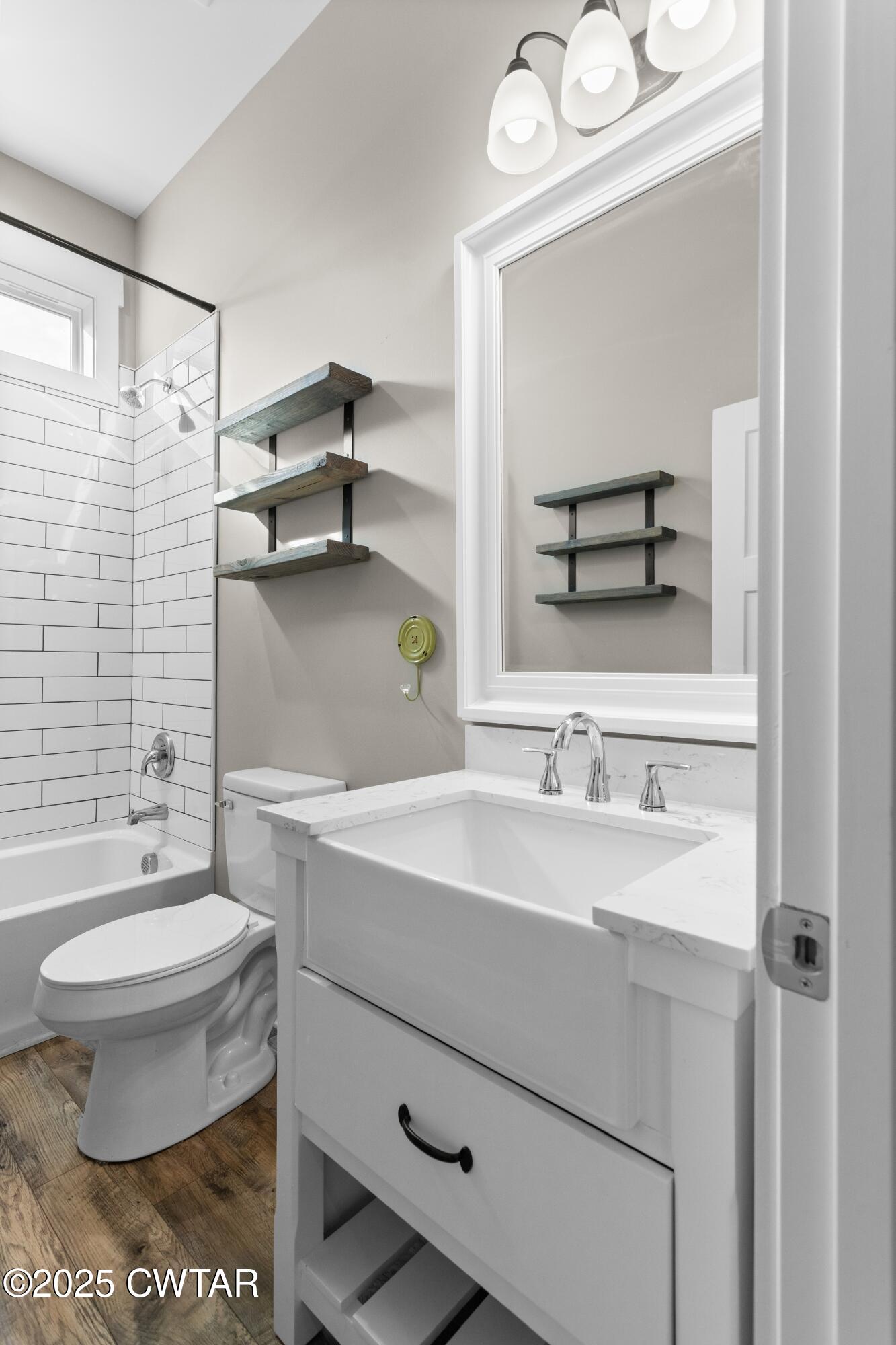 3154 Dodson Gap Road Culleoka, TN 38451 - Photo 28 of 36 a bathroom with a sink toilet a mirror and shower