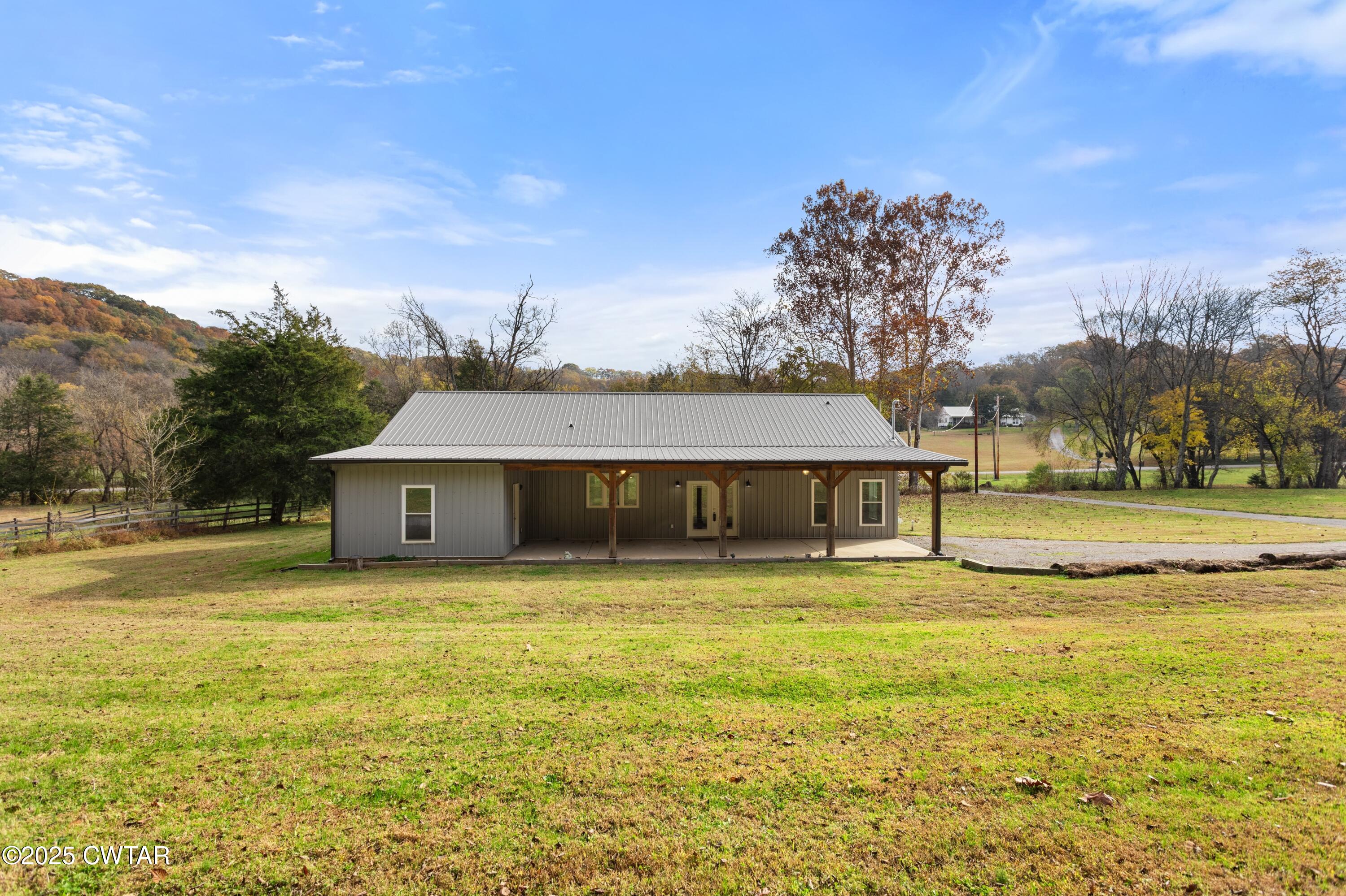 3154 Dodson Gap Road Culleoka, TN 38451 - Photo 32 of 36 a view of a house with a yard