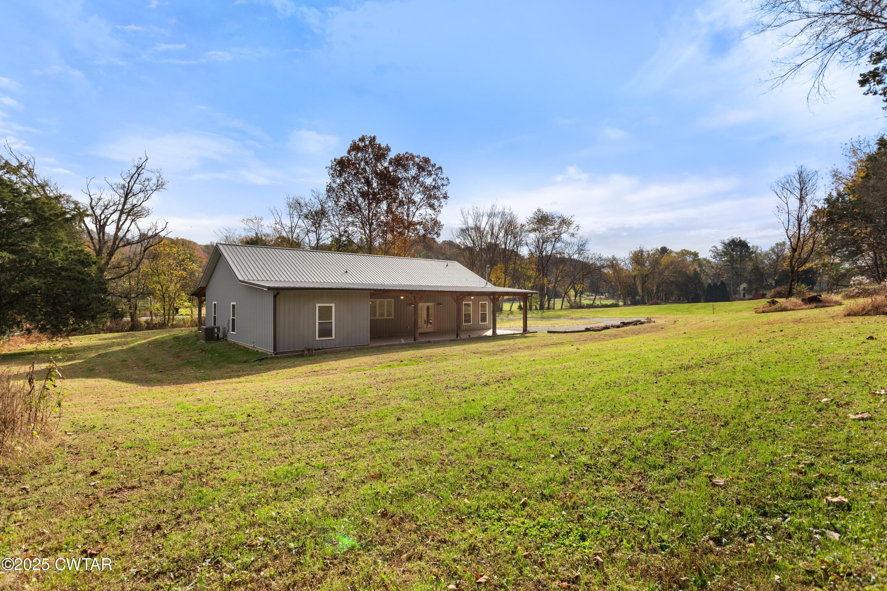 3154 Dodson Gap Road Culleoka, TN 38451 - Photo 33 of 36 a view of a house with a yard