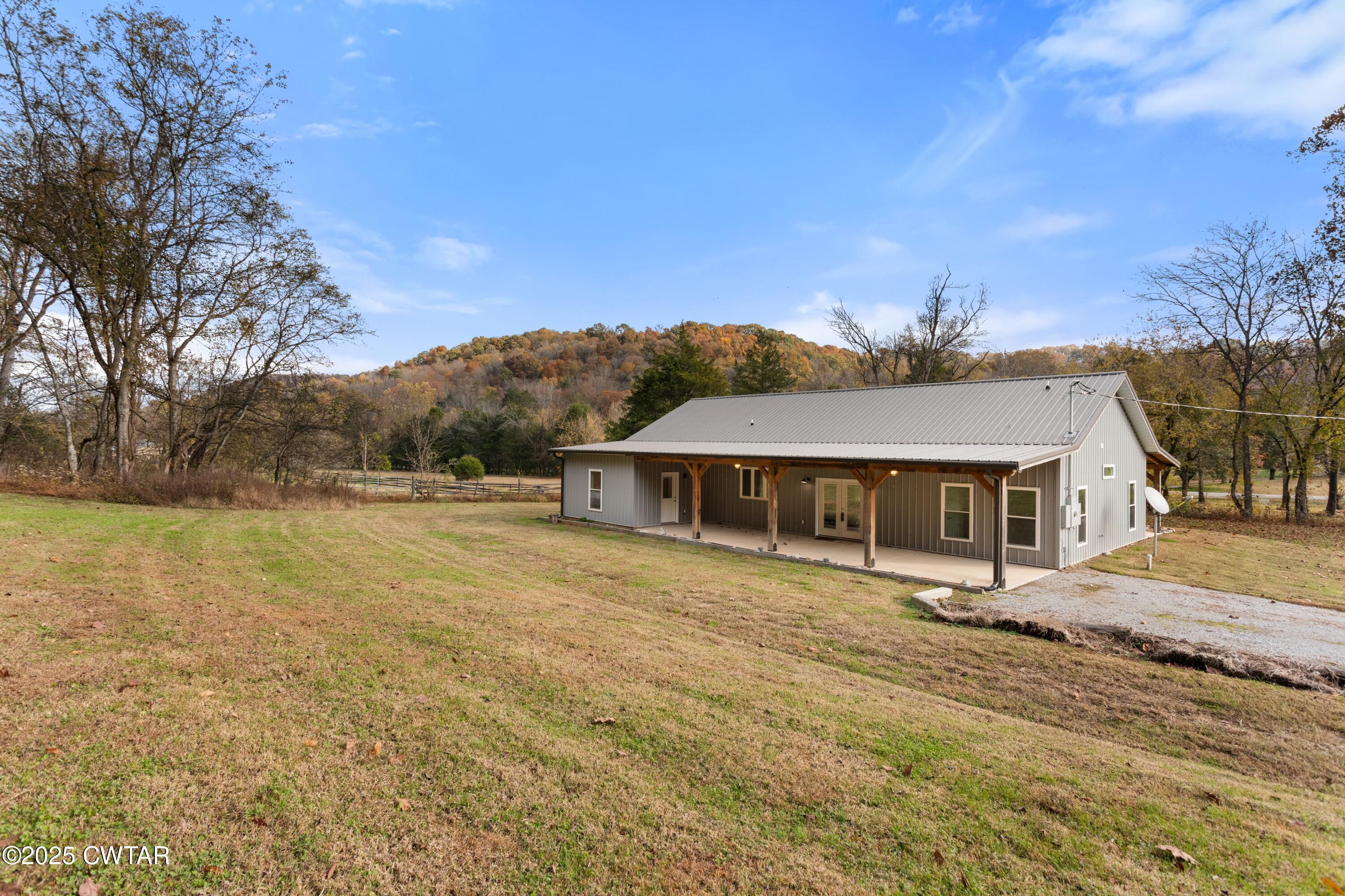 3154 Dodson Gap Road Culleoka, TN 38451 - Photo 34 of 36 a view of house with outdoor space and garden