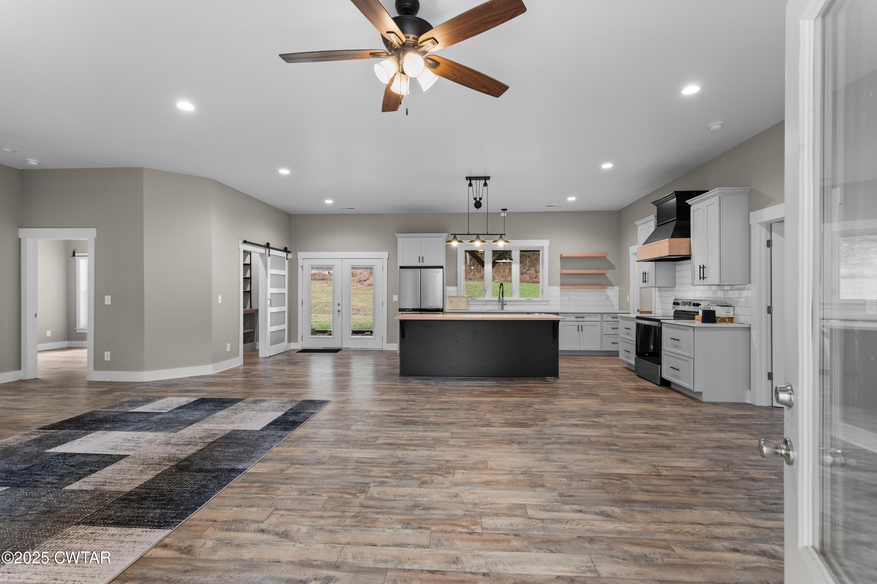 3154 Dodson Gap Road Culleoka, TN 38451 - Photo 6 of 36 a view of kitchen with microwave and refrigerator
