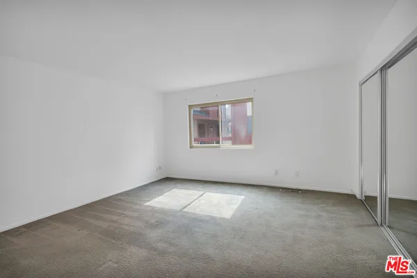 an empty room with a empty space and window