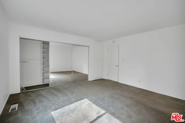 a view of a hallway with closet