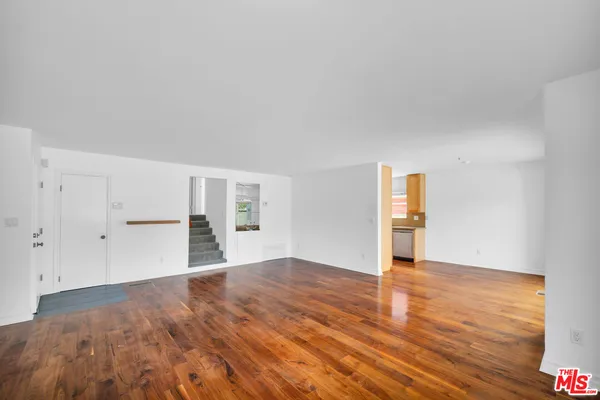 a kitchen with a sink and a window