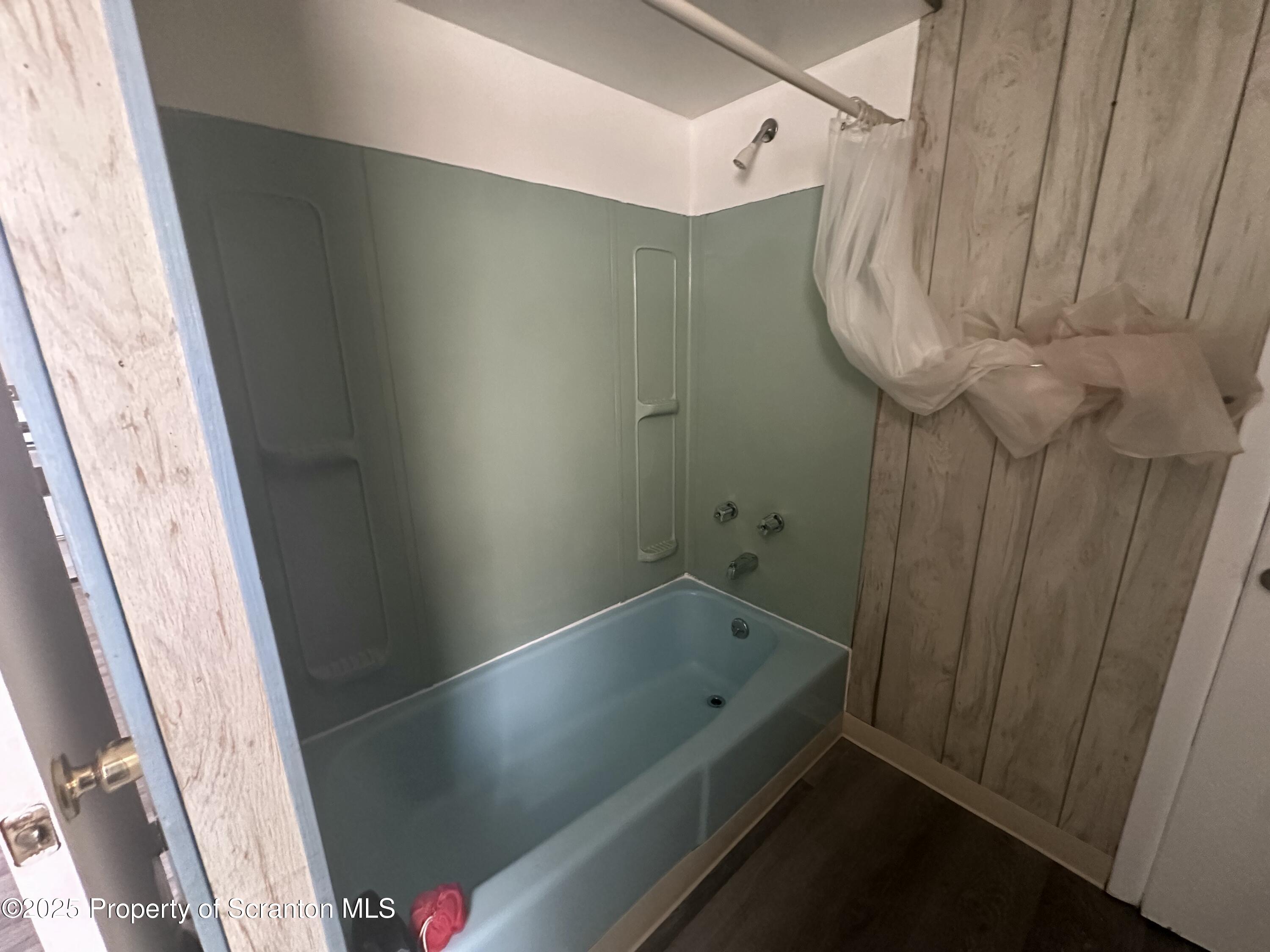 65 Center Street, Unit 2 Pittston, PA 18640 - Photo 13 of 14 a bathroom with a bathtub and shower