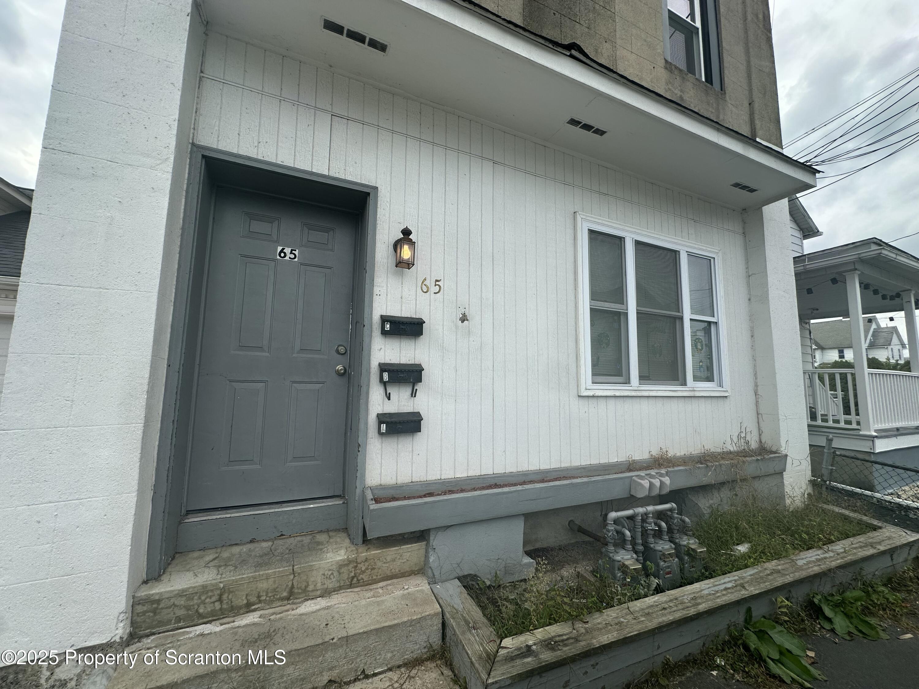 65 Center Street, Unit 2 Pittston, PA 18640 - Photo 2 of 14 a front view of a house with windows