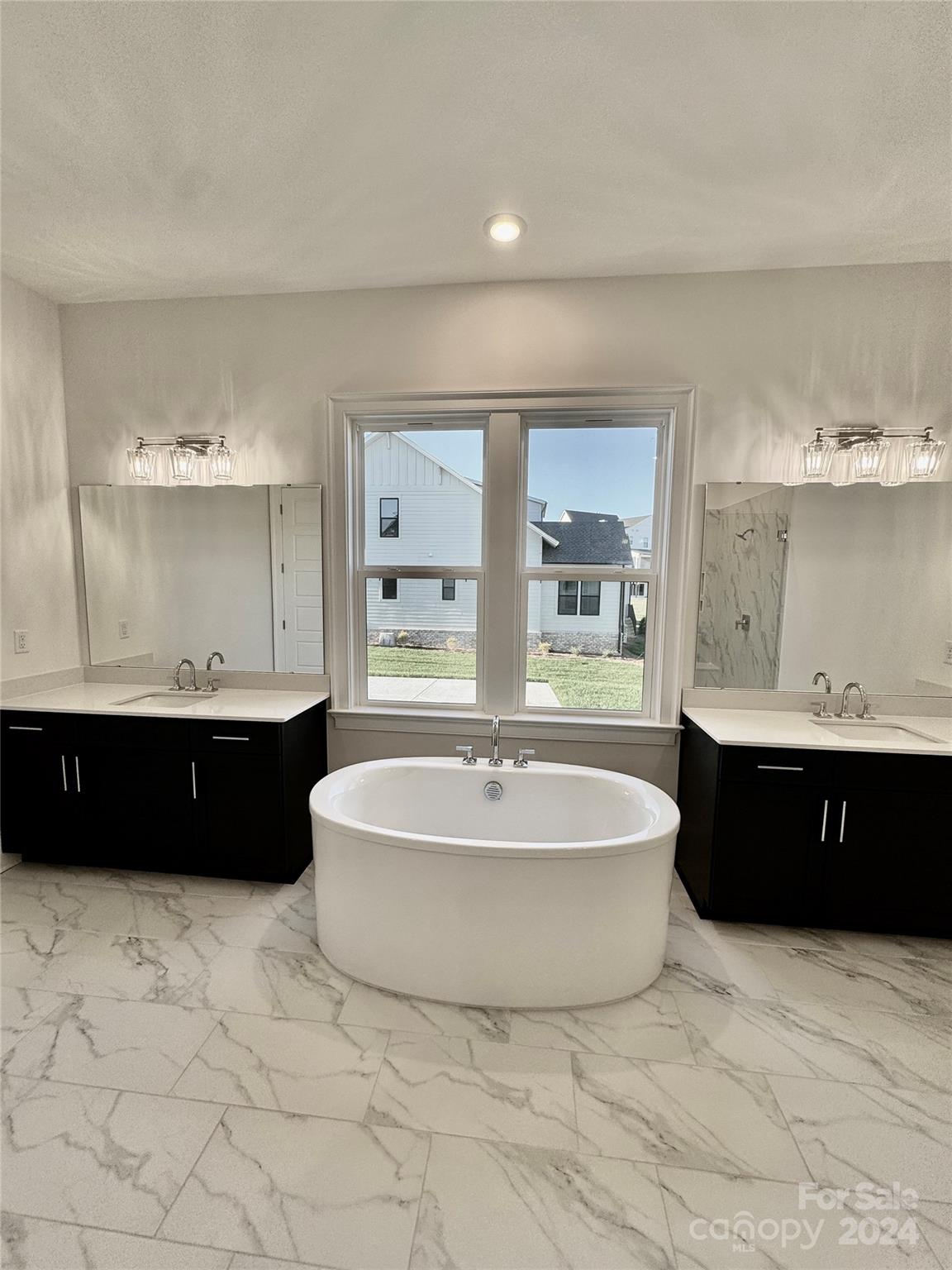 1318 Pomar Circle Marvin, NC 28173 - Photo 17 of 22 a living room with a bathtub cabinets and a window