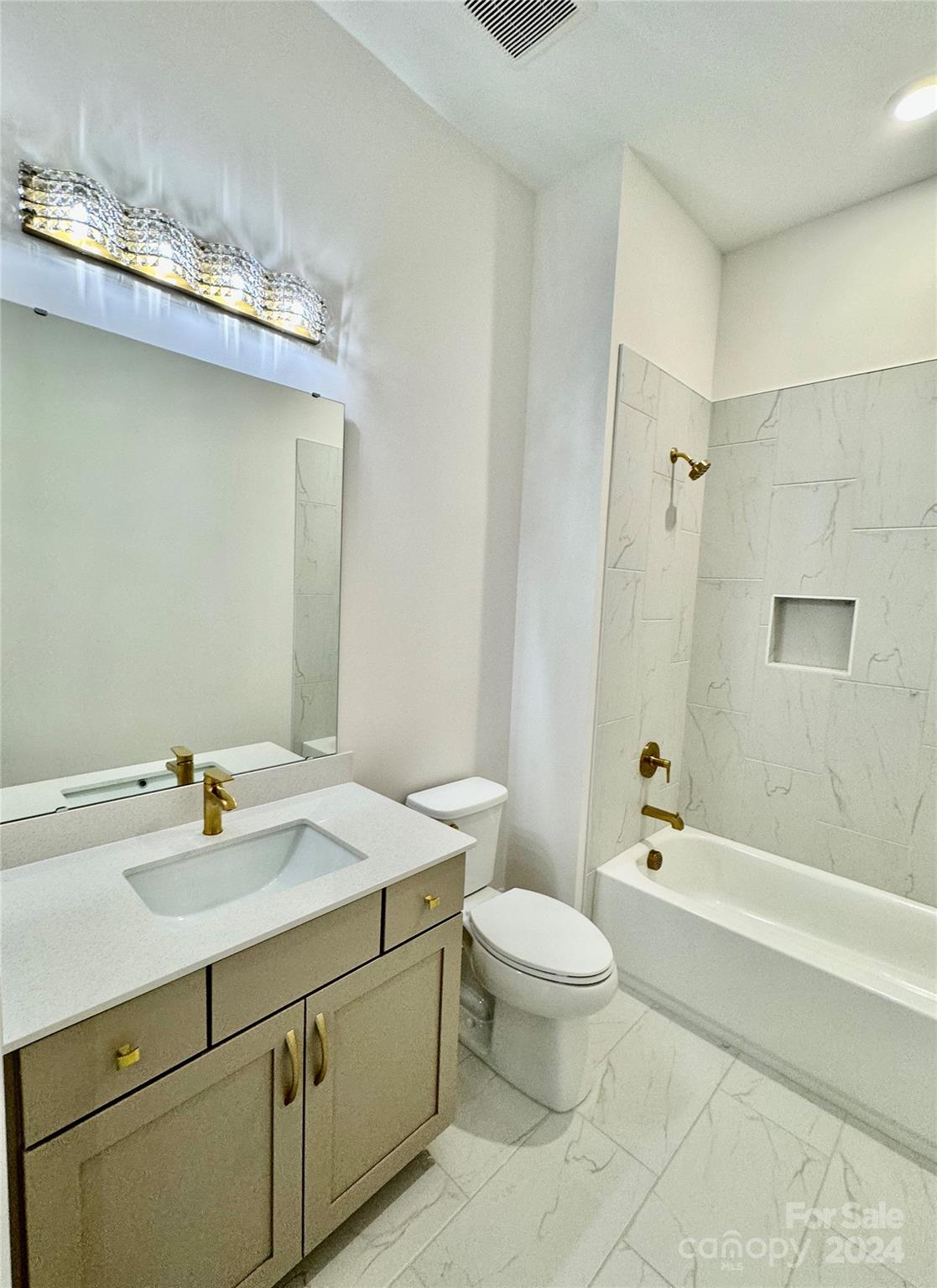 1318 Pomar Circle Marvin, NC 28173 - Photo 20 of 22 a bathroom with a sink a toilet and shower