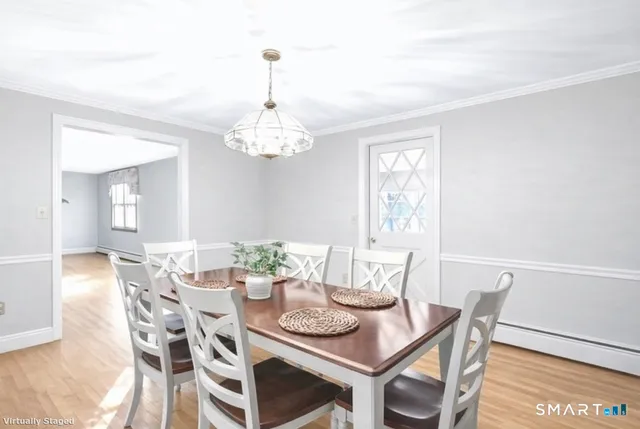 a front view of a house with garden and parking