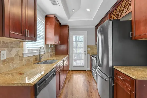 a kitchen with a sink and cabinets