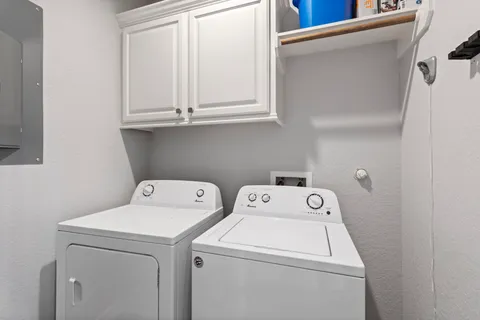a utility room with dryer and washer