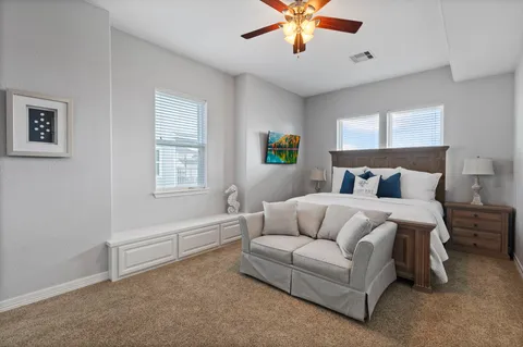 a bed room with a bed and a chandelier