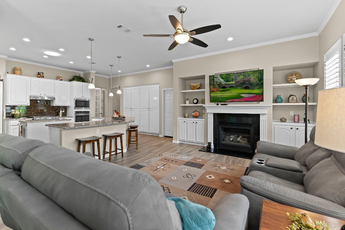 103 Trail Rider Way Georgetown, TX 78633 - Photo 23 of 39 a living room with furniture and a fireplace