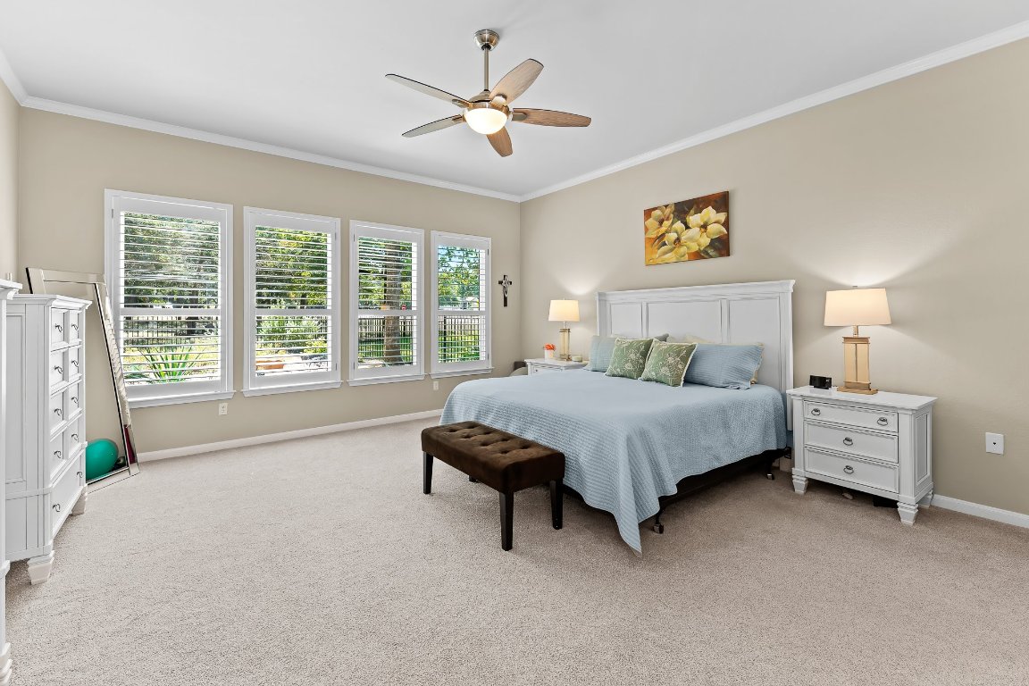 103 Trail Rider Way Georgetown, TX 78633 - Photo 28 of 39 a bedroom with a bed dresser and a two windows