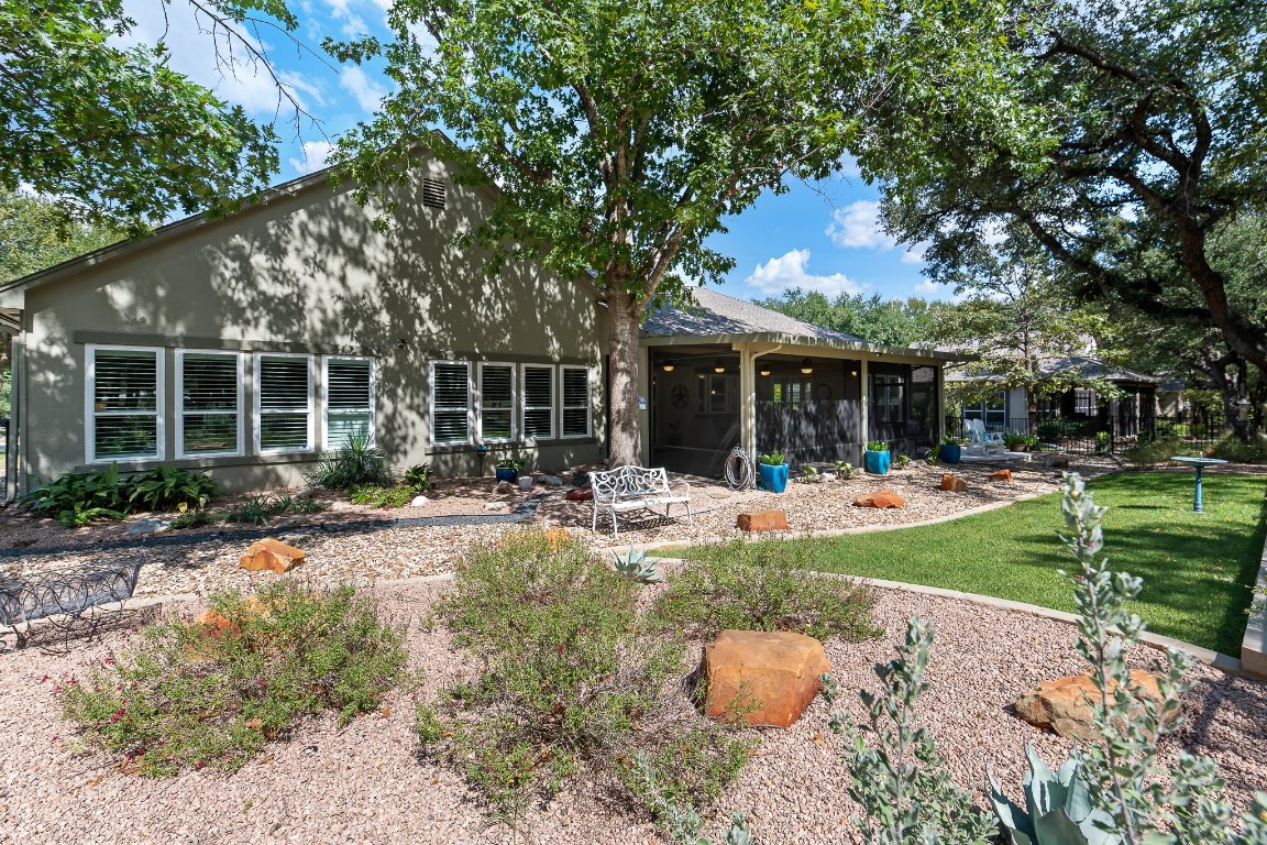 103 Trail Rider Way Georgetown, TX 78633 - Photo 35 of 39 a view of a patio with table and chairs potted plants and large tree